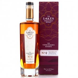 A clear glass bottle of The Lakes Whiskymaker's Reserve No.2 Single Malt Whisky and purple presentation box with gold detail