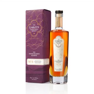 A clear glass bottle of The Lakes Whiskymaker's Reserve No.3 Single Malt Whisky and purple presentation box with gold detail