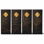 Four black matte presentation boxes with gold detail which house The Lakes Quatrefoil Single Malt Whisky Collection