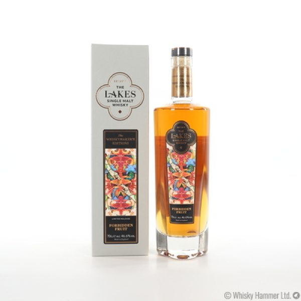 A clear glass bottle of The Lakes Forbidden Whiskymaker's Edition Single Malt Whisky and ivory presentation box with gold detailing
