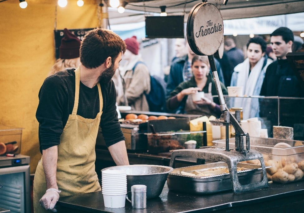 Man at a stall at a food festival